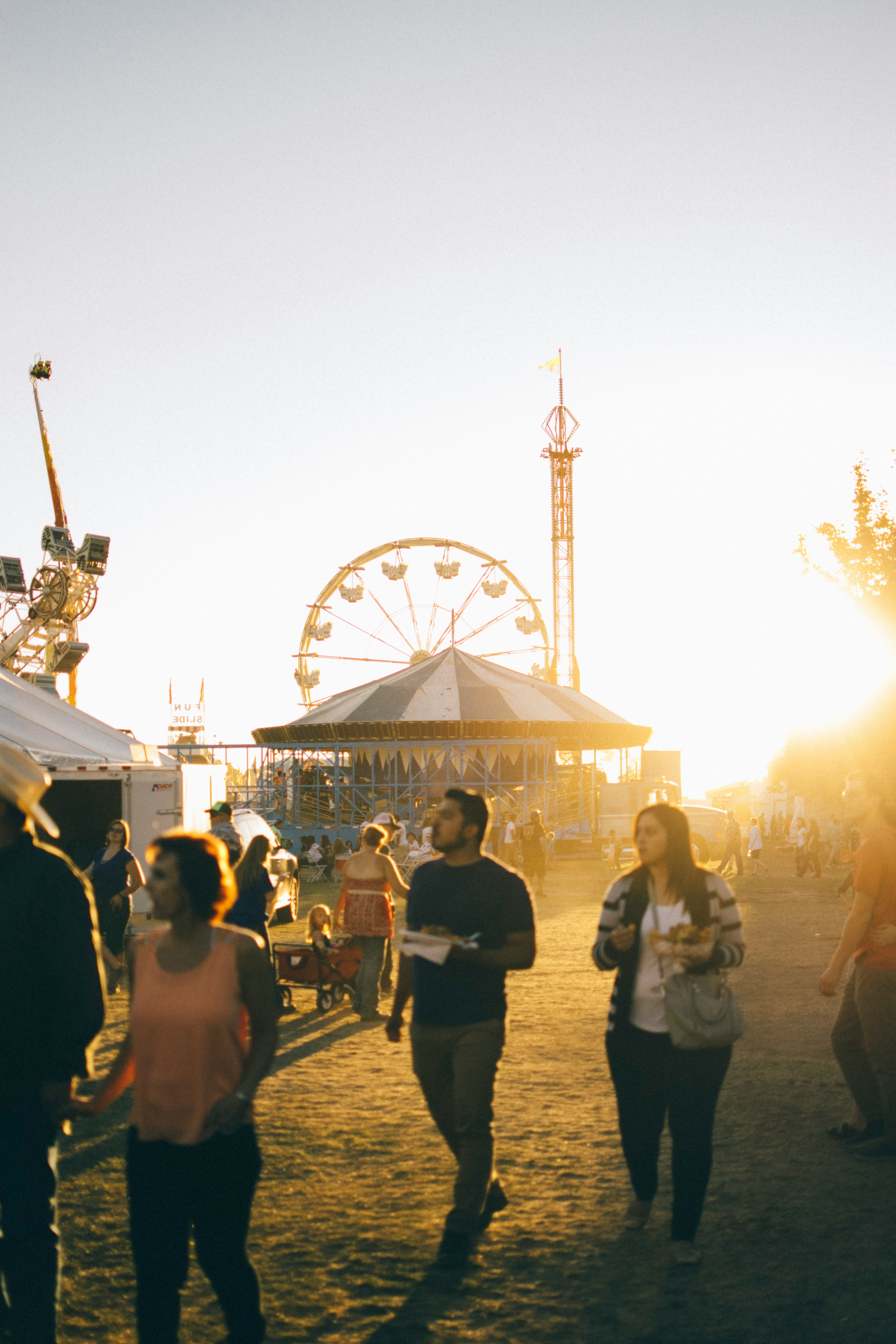 group of people walking on amusement park